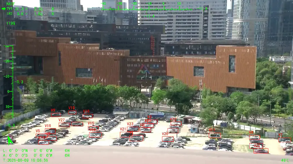 Aerial view of a working site with vehicles and equipment picked out by the payload