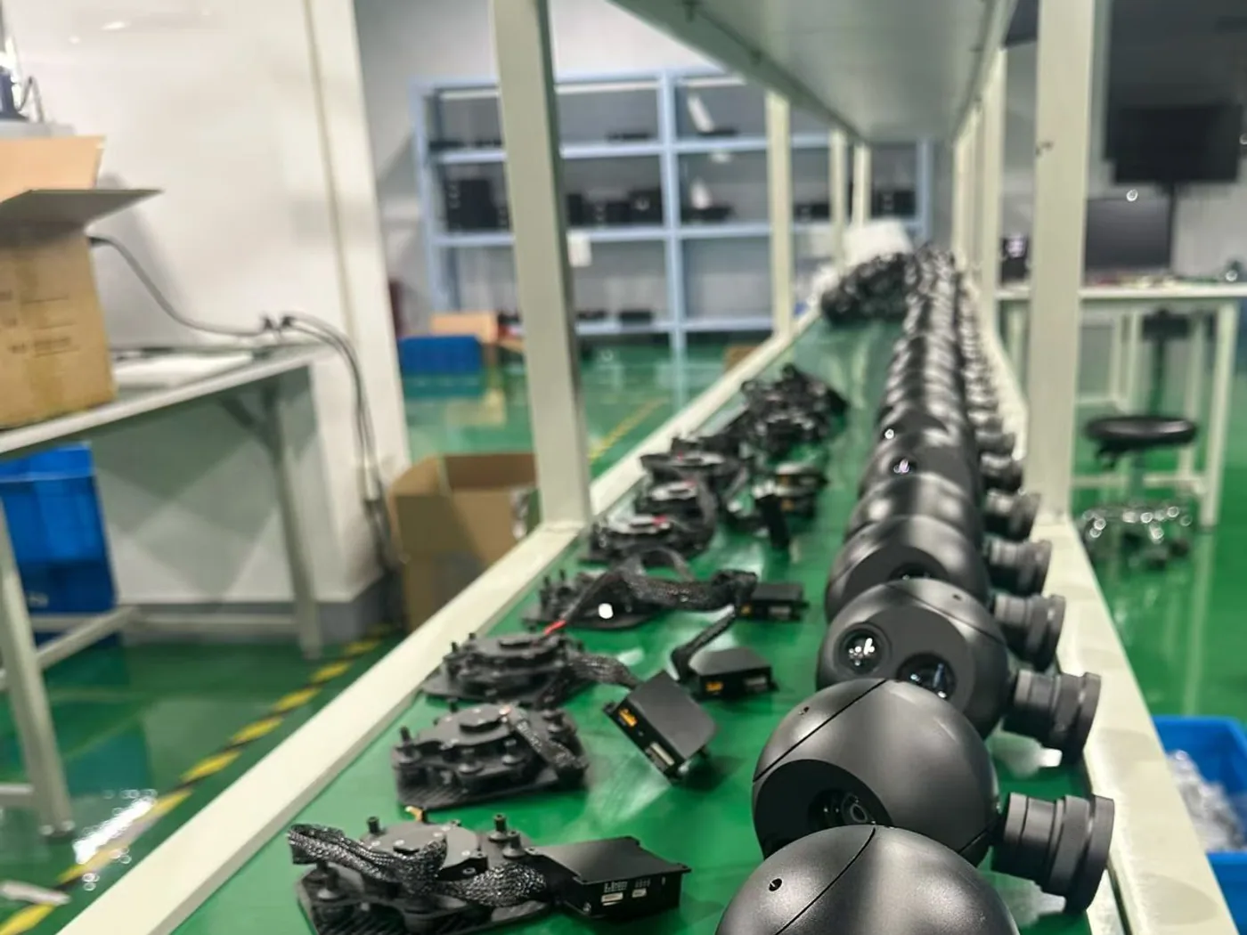 Row of assembled gimbal camera payload heads at the end of the HITS production line