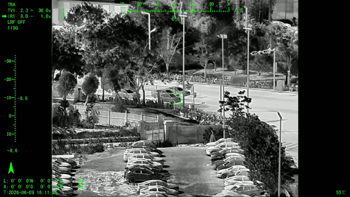 Thermal image from a UAV payload tracking figures and vehicles after dark