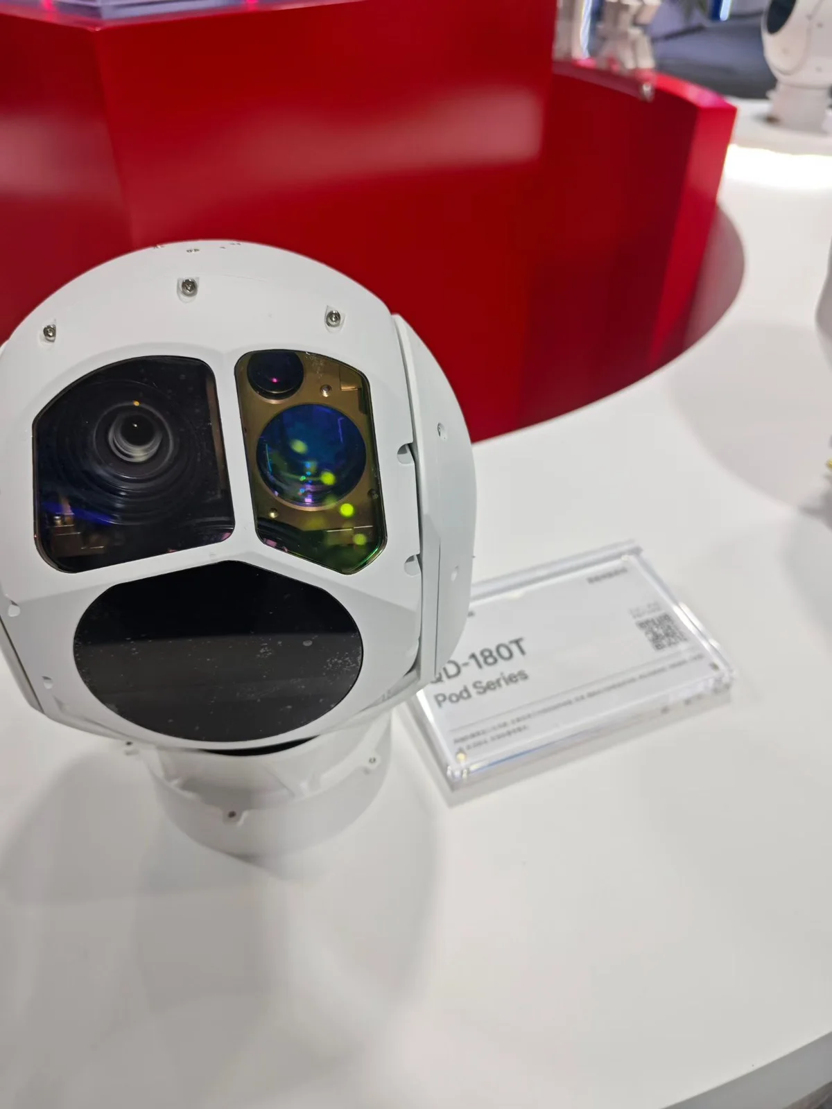 HITS gimbal camera pod on a display stand showing the sensor layout of the pod series