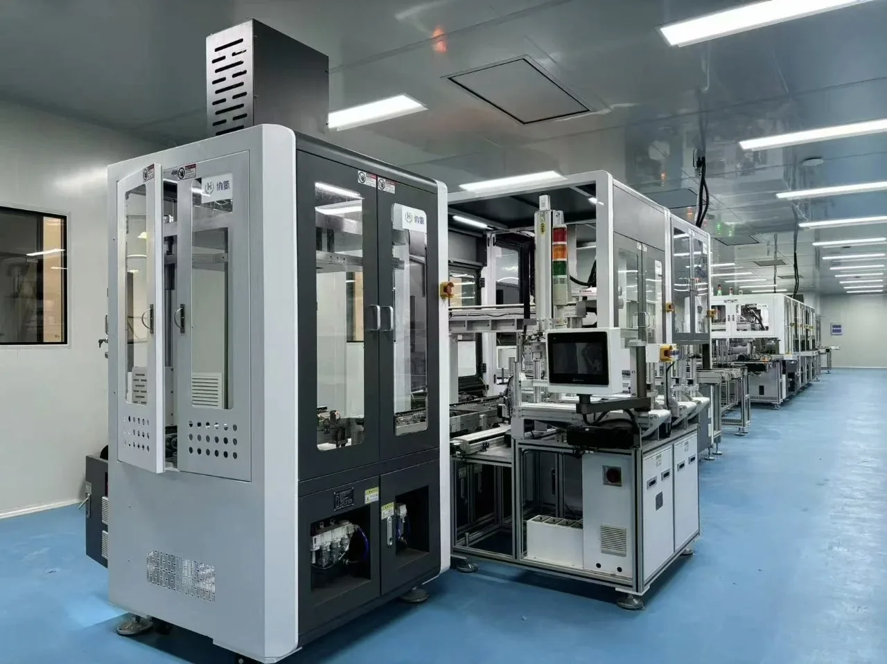 Optics and electronics production equipment in a controlled cleanroom at the HITS payload factory
