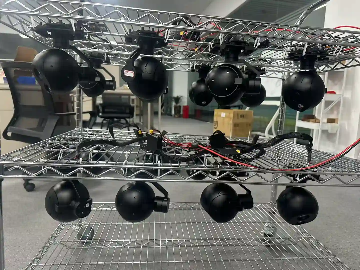 Gimbal camera payload heads mounted on the calibration and stabilisation test rack at the HITS factory