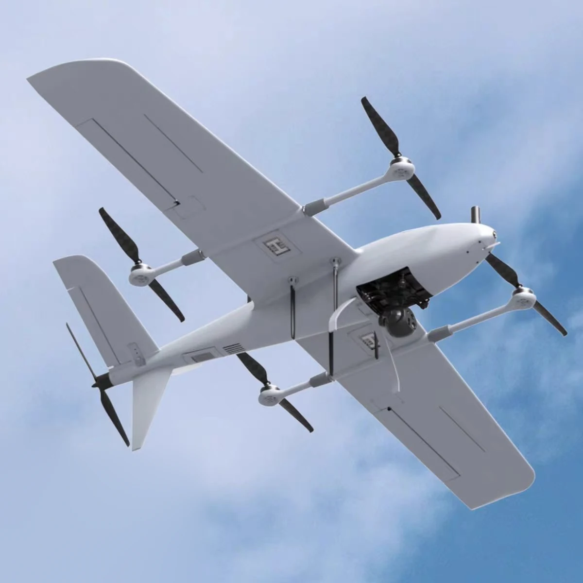 VTOL fixed-wing UAV with a gimbal imaging payload fitted under the fuselage in flight