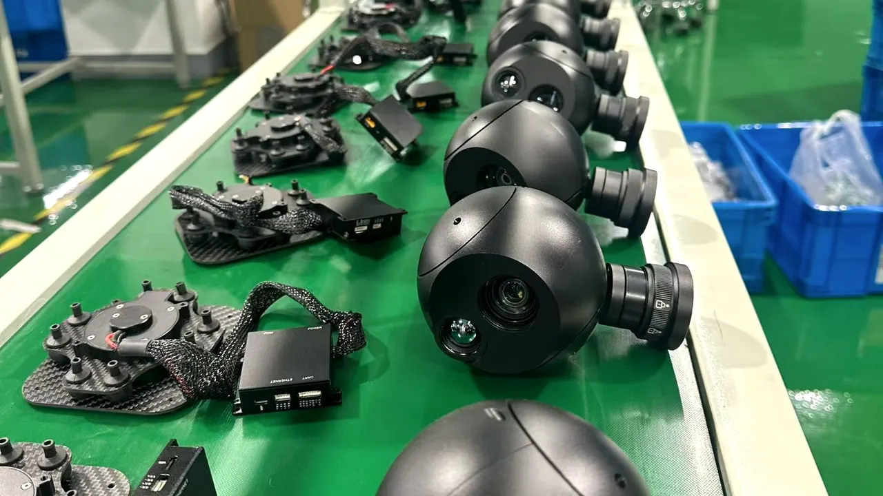 Stabilised gimbal camera payloads on the HITS production line, with EO and thermal heads in assembly