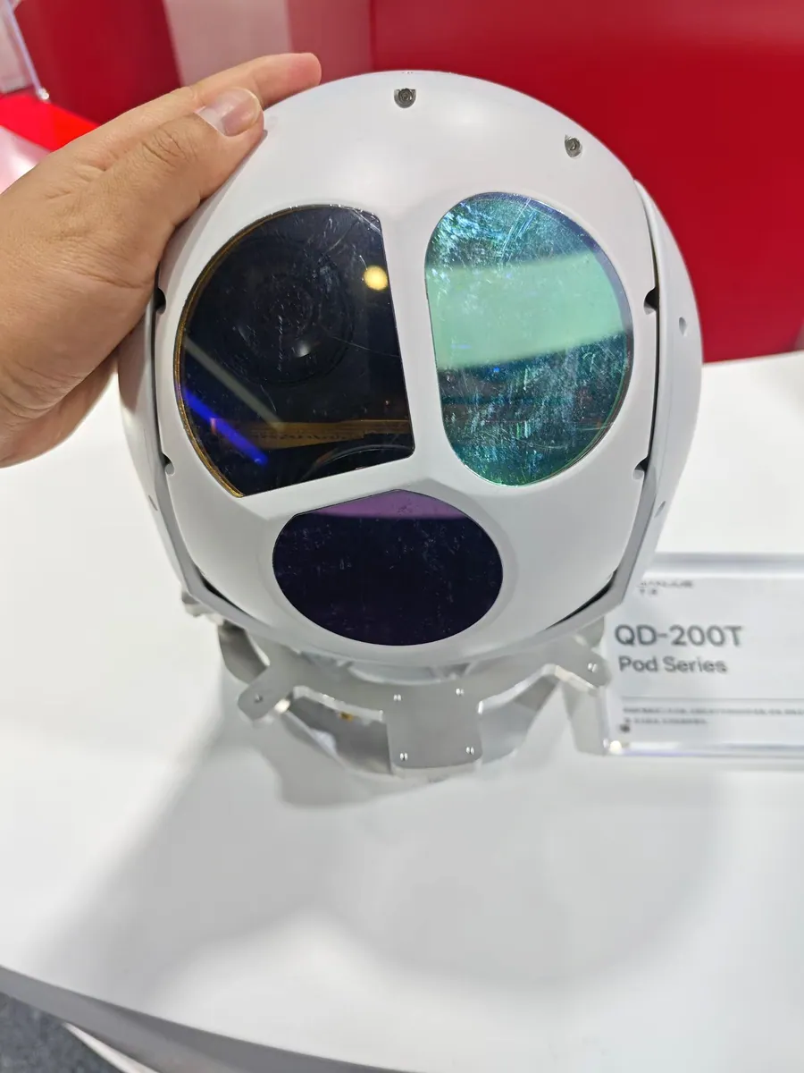 Multi-sensor gimbal camera payload housing showing several optical windows side by side in one stabilised ball