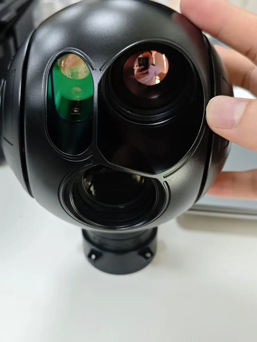Multi-window gimbal camera payload head showing visible light, thermal and laser apertures