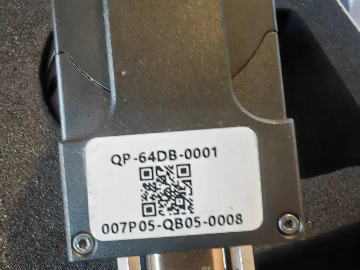 Rear of a HITS gimbal camera payload showing the mounting bracket, unit nameplate and serial number